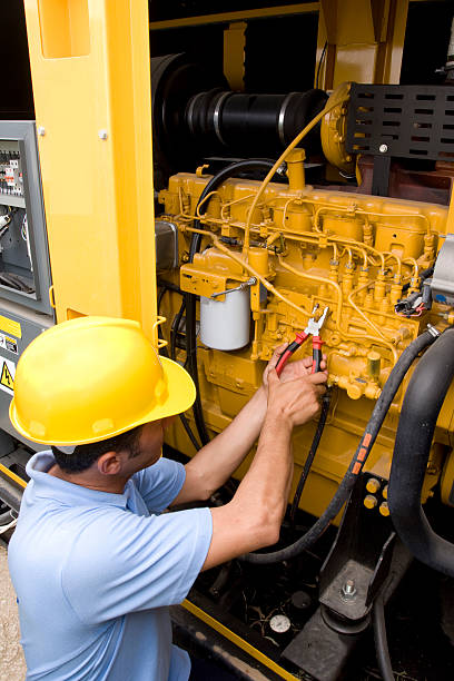 technician is fixing the problem on generator